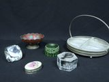 a lot of glass items on a black surface