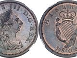 a close up of a coin with a crown on it