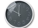 a clock that is on the wall with numbers on it
