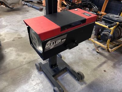 a machine that is sitting on a stand in a garage