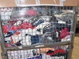 a metal cart with many items in it in a warehouse
