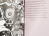 an open book with a drawing on it on a table