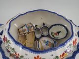 a blue and white bowl that has a pair of shoes in it