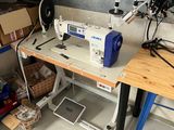 a sewing machine sitting on a table in a room
