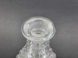 a clear glass vase with a clear top on a table