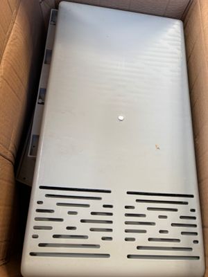 an open box with a laptop inside of it sitting on a table
