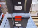several plastic storage boxes stacked on top of each other on a pallet