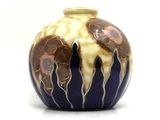 a vase that has a blue and yellow design on it