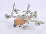 a toy airplane that is sitting on a white surface