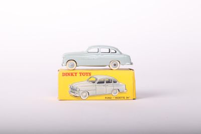 two toy cars sitting on top of a yellow box