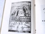 an open book with a picture of a castle on it