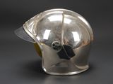 a silver helmet that is on a black table