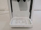 a water dispenser that is sitting on a counter