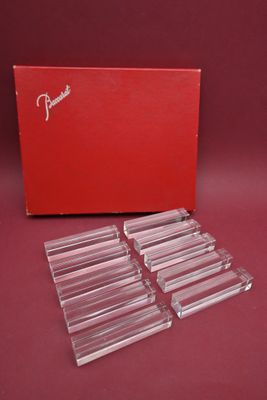 a set of four clear acrylic coasters with a red box