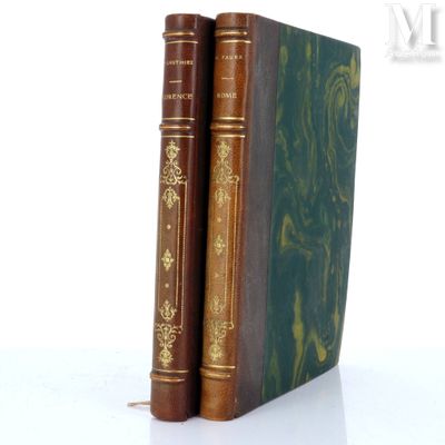 two books sitting next to each other on a white surface