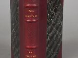 the book is red and black with gold lettering on it