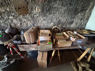 a pile of boxes sitting on top of a wooden table