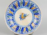 an image of a blue and white plate with a bird on it