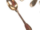 five spoons and two spoon spoons on a white surface