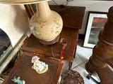 a lamp that is sitting on a table next to a chair