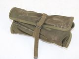 a roll up bag that is sitting on the ground