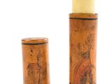 pair of wooden candlesticks with a painting of a man and a woman