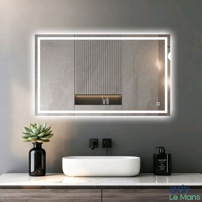 a white sink sitting under a large mirror in a bathroom
