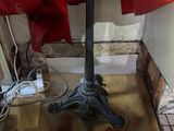 a small table with a red umbrella on top of it