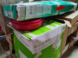 many boxes stacked on top of each other in a room