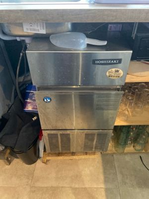 an image of a stainless steel refrigerator in a kitchen
