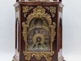 a small clock that is sitting on a table