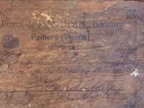 a piece of wood with writing on it sitting on a table