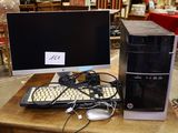 a desktop computer sitting on a table with a keyboard and mouse