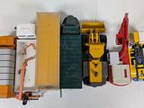 a lot of different toy vehicles that are sitting on a table