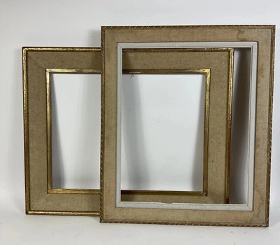 two picture frames with gold trims on a white background