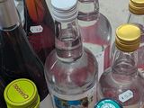 many bottles of alcohol sitting on a table
