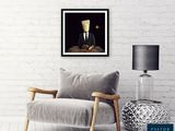 a white chair sitting next to a white brick wall and a lamp