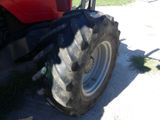 a tractor that is parked on the side of the road