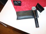 a microphone and a wallet sitting on a table