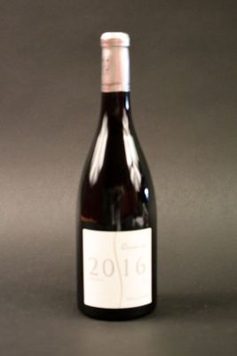 a bottle of wine that is sitting on a table