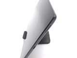 a close up of a laptop on a stand on a white surface