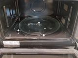 a close up of an oven with a pan inside of it