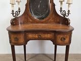an image of a wooden vanity with a mirror on top of it