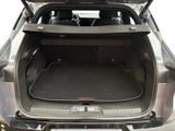 the back of a car with its trunk open and the back of the car with its trunk open