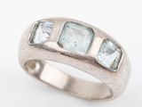 an image of a ring with three stones in it