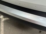 a close up of a car ' s bumper with a sticker on it
