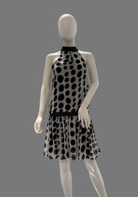 an image of a mannequin dressed in a polka dot print dress