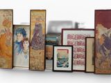 a lot of framed pictures on a shelf next to a tv