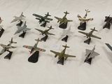 a lot of toy airplanes that are sitting on a table