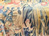 a close up view of a floral tapestry on a table